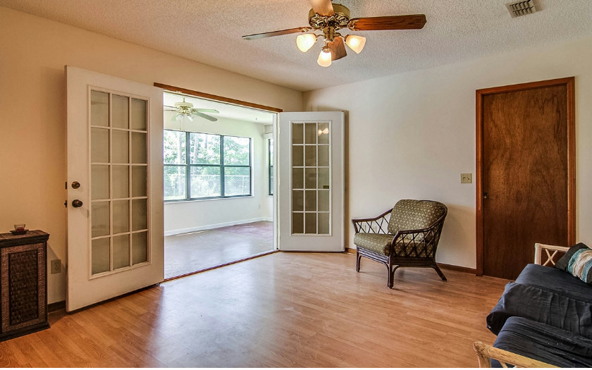 75043 Edwards Road Yulee, FL 32097 - Photo 20 of 21 a view of workspace with wooden floor windows and windows