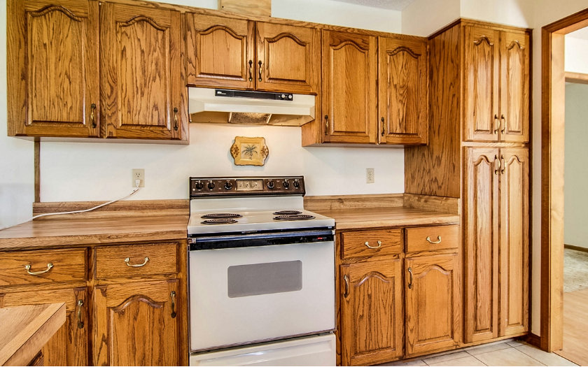 75043 Edwards Road Yulee, FL 32097 - Photo 7 of 21 a kitchen with stainless steel appliances granite countertop a stove and a refrigerator