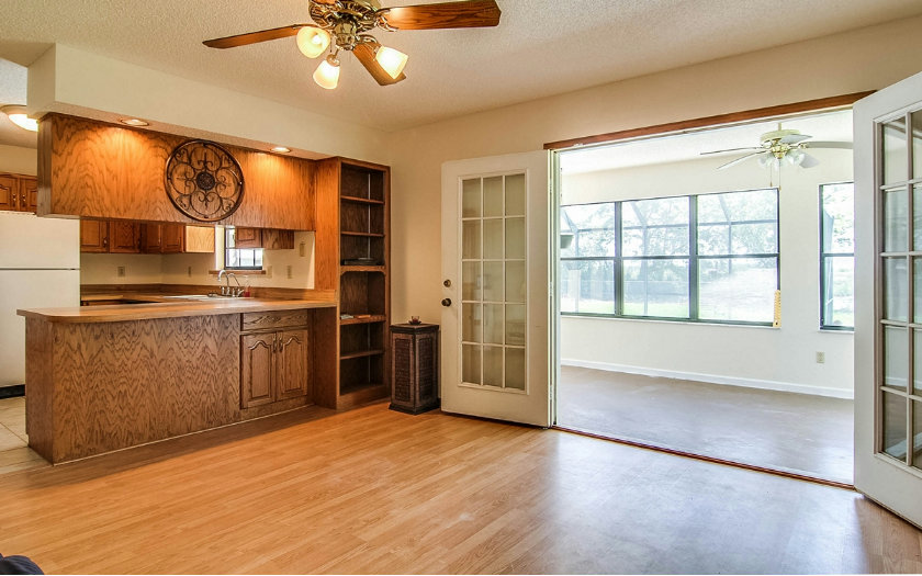 75043 Edwards Road Yulee, FL 32097 - Photo 8 of 21 a kitchen with stainless steel appliances granite countertop a stove a sink and a refrigerator