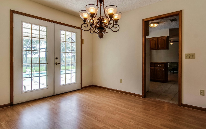 75043 Edwards Road Yulee, FL 32097 - Photo 9 of 21 wooden floor in an empty room with a window