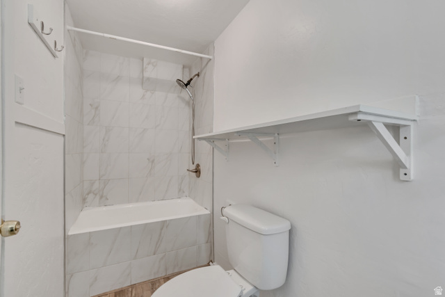 8831 South 400 East Sandy, UT 84070 - Photo 14 of 26 Bathroom featuring toilet and a combined bath / shower with marble appearance