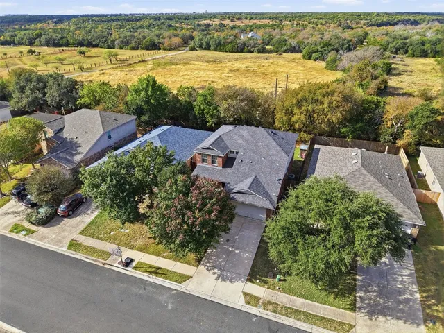an aerial view of a house with a lake view