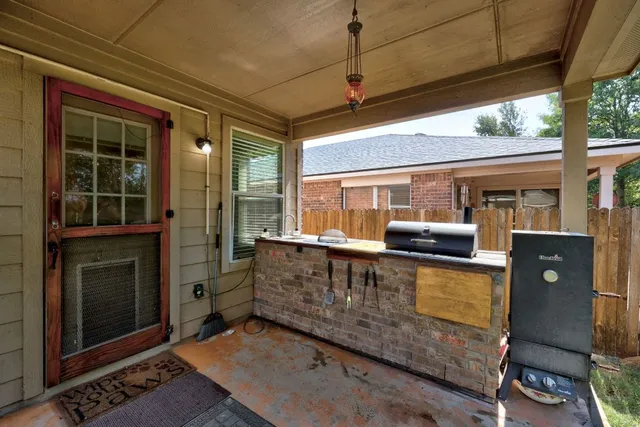 a view of balcony with furniture