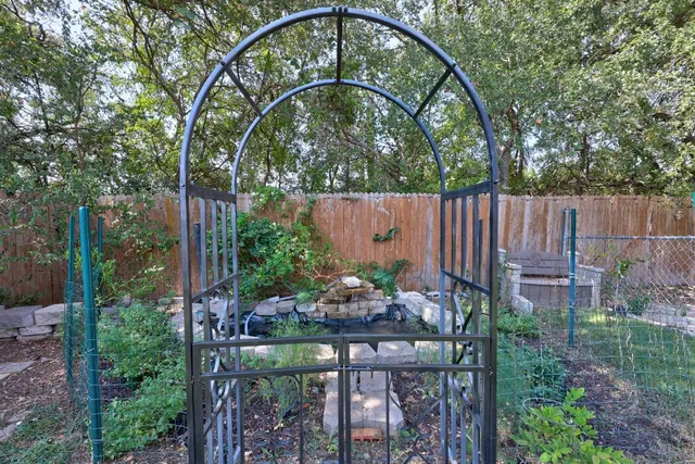 a view of a lake with houses in the back