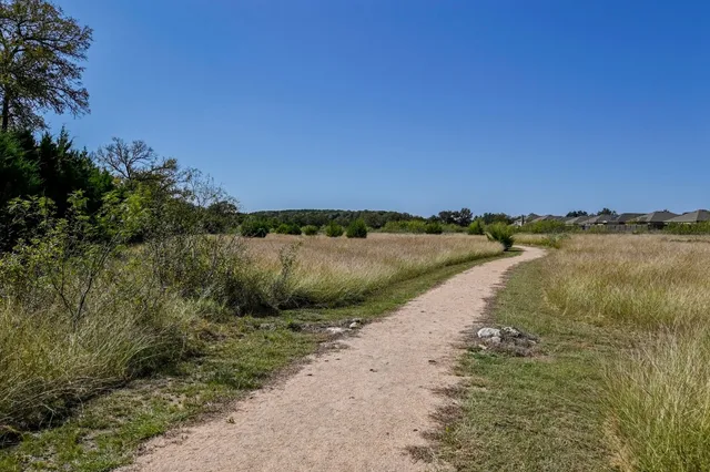 a view of a swimming pool with an outdoor space and seating area