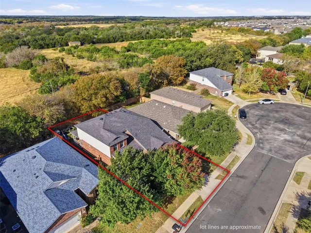 an aerial view of a house with a garden