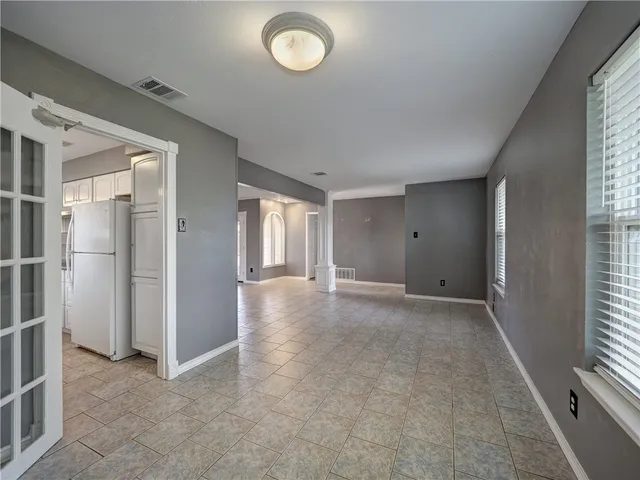 an empty room with windows