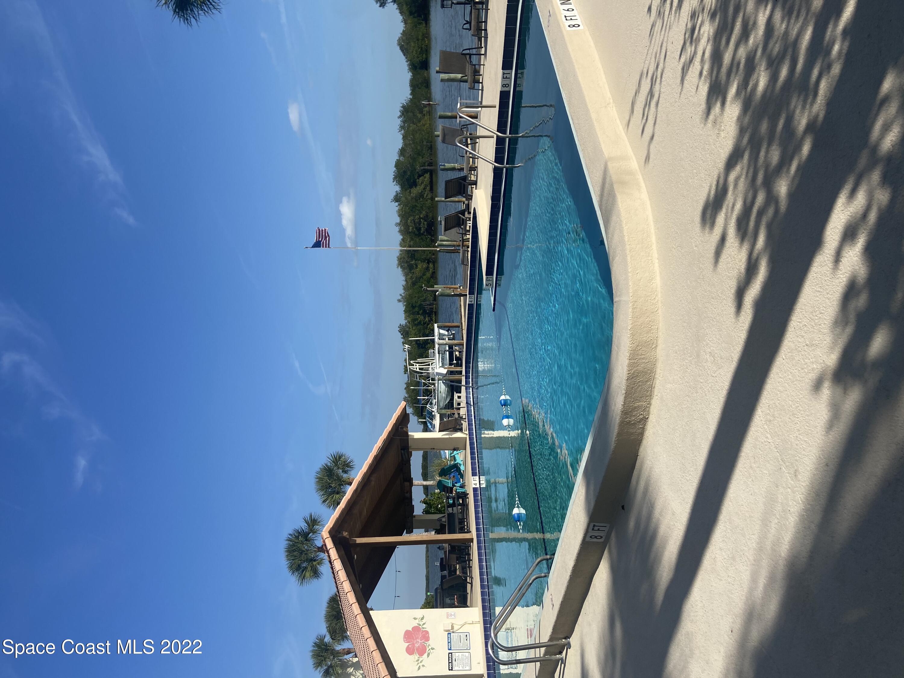 1611 Minutemen Causeway, Unit 207 Cocoa Beach, FL 32931 - Photo 1 of 11 a view of an outdoor space and swimming pool