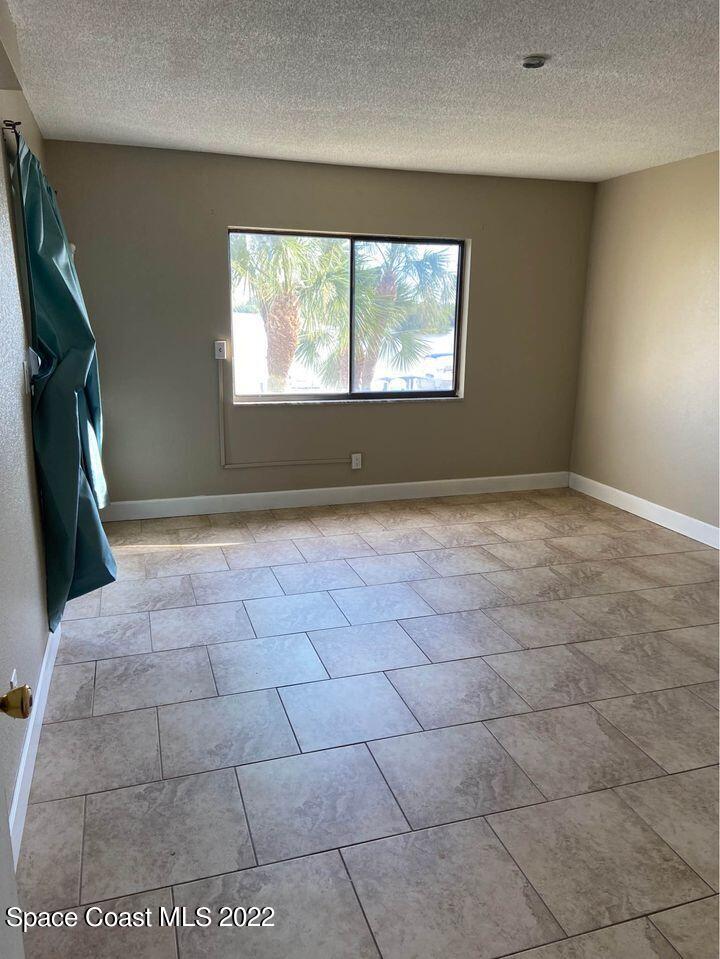 1611 Minutemen Causeway, Unit 207 Cocoa Beach, FL 32931 - Photo 7 of 11 a view of empty room with window