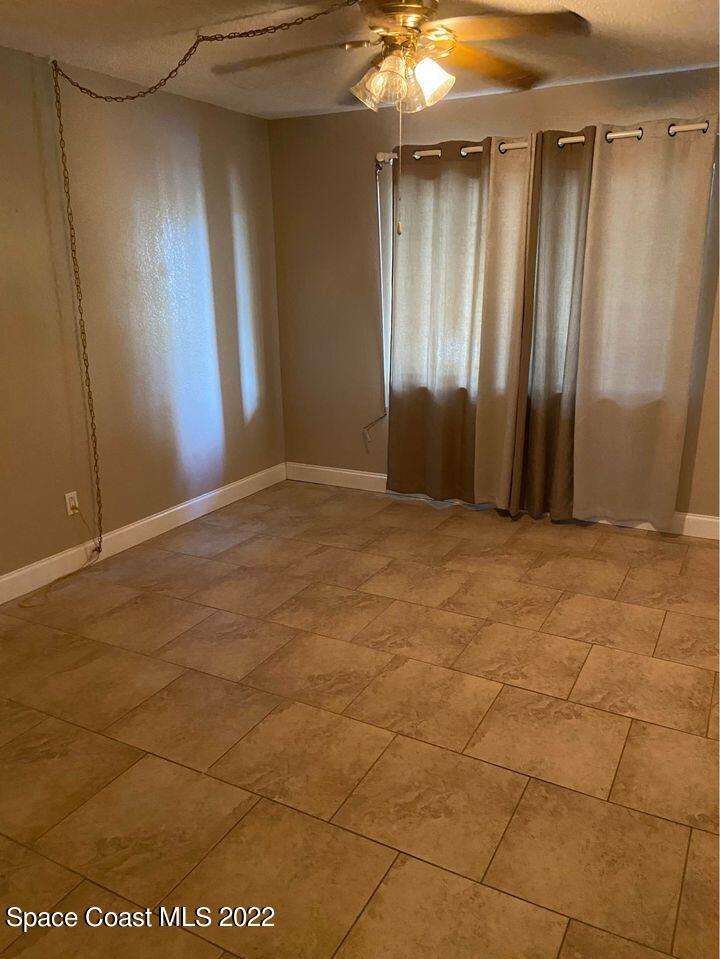 1611 Minutemen Causeway, Unit 207 Cocoa Beach, FL 32931 - Photo 9 of 11 a view of empty room with windows