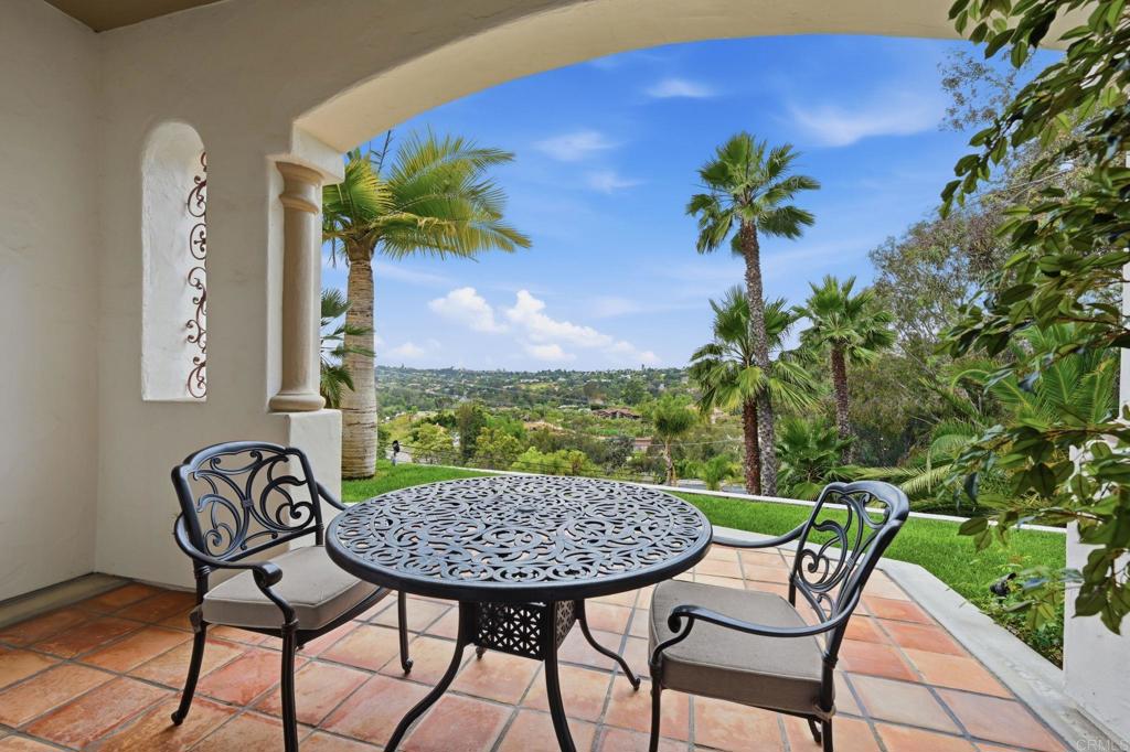 3244 Olivenhain Farms Road Encinitas, CA 92024 - Photo 28 of 47 a view of a chairs and table in the patio