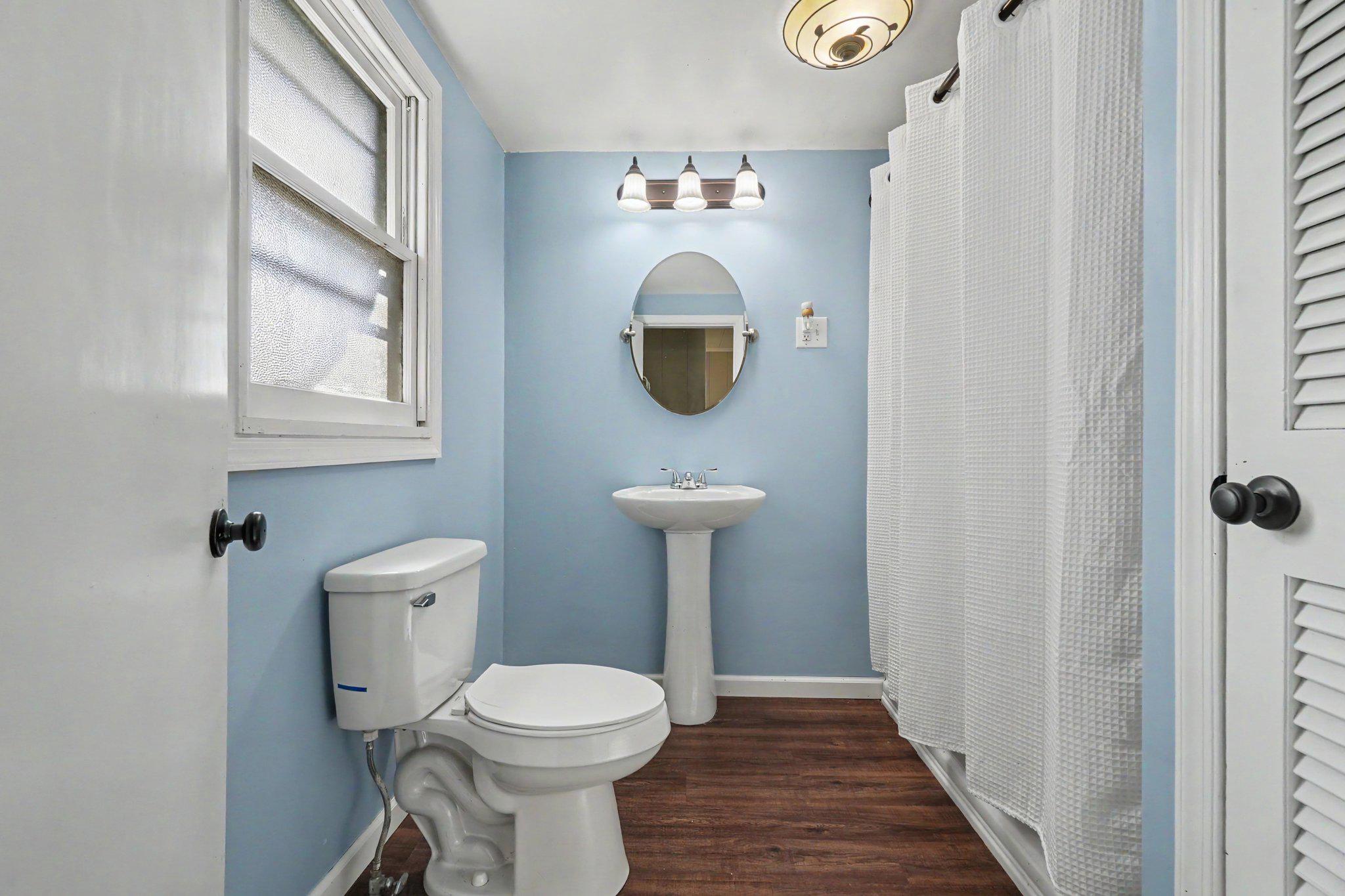 418 Elizabeth Street Williamstown, PA 17098 - Photo 13 of 34 a bathroom with a toilet sink and mirror