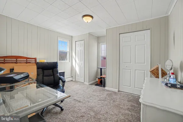 a view of a livingroom with furniture and windows