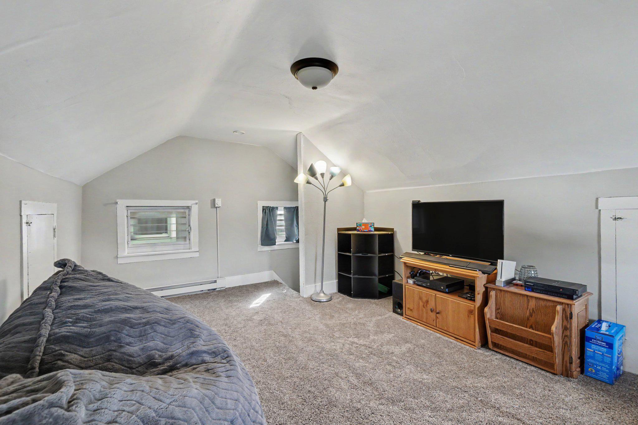 418 Elizabeth Street Williamstown, PA 17098 - Photo 19 of 34 a bedroom with a bed and a flat screen tv