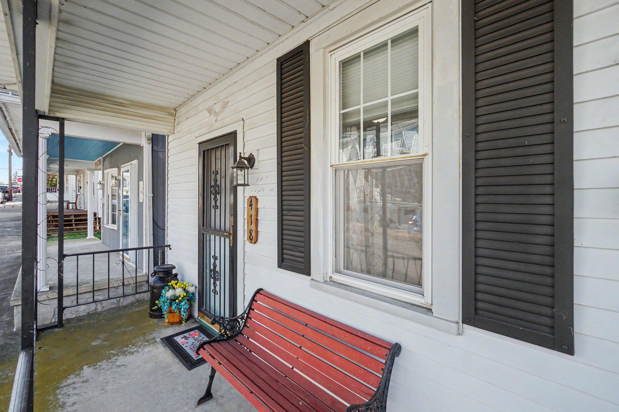 418 Elizabeth Street Williamstown, PA 17098 - Photo 30 of 34 a bench is sitting in front of a house