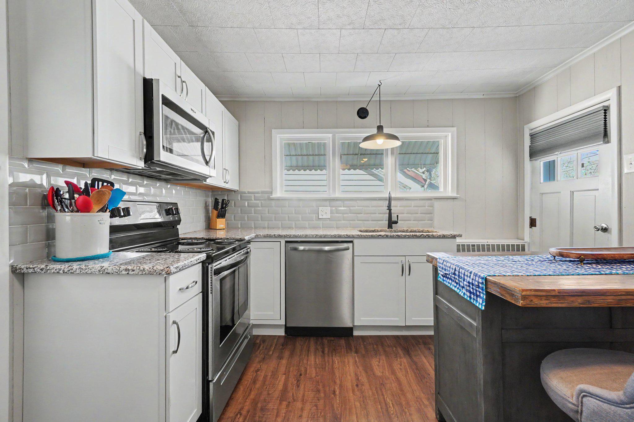 418 Elizabeth Street Williamstown, PA 17098 - Photo 4 of 34 a kitchen with a sink cabinets and wooden floor
