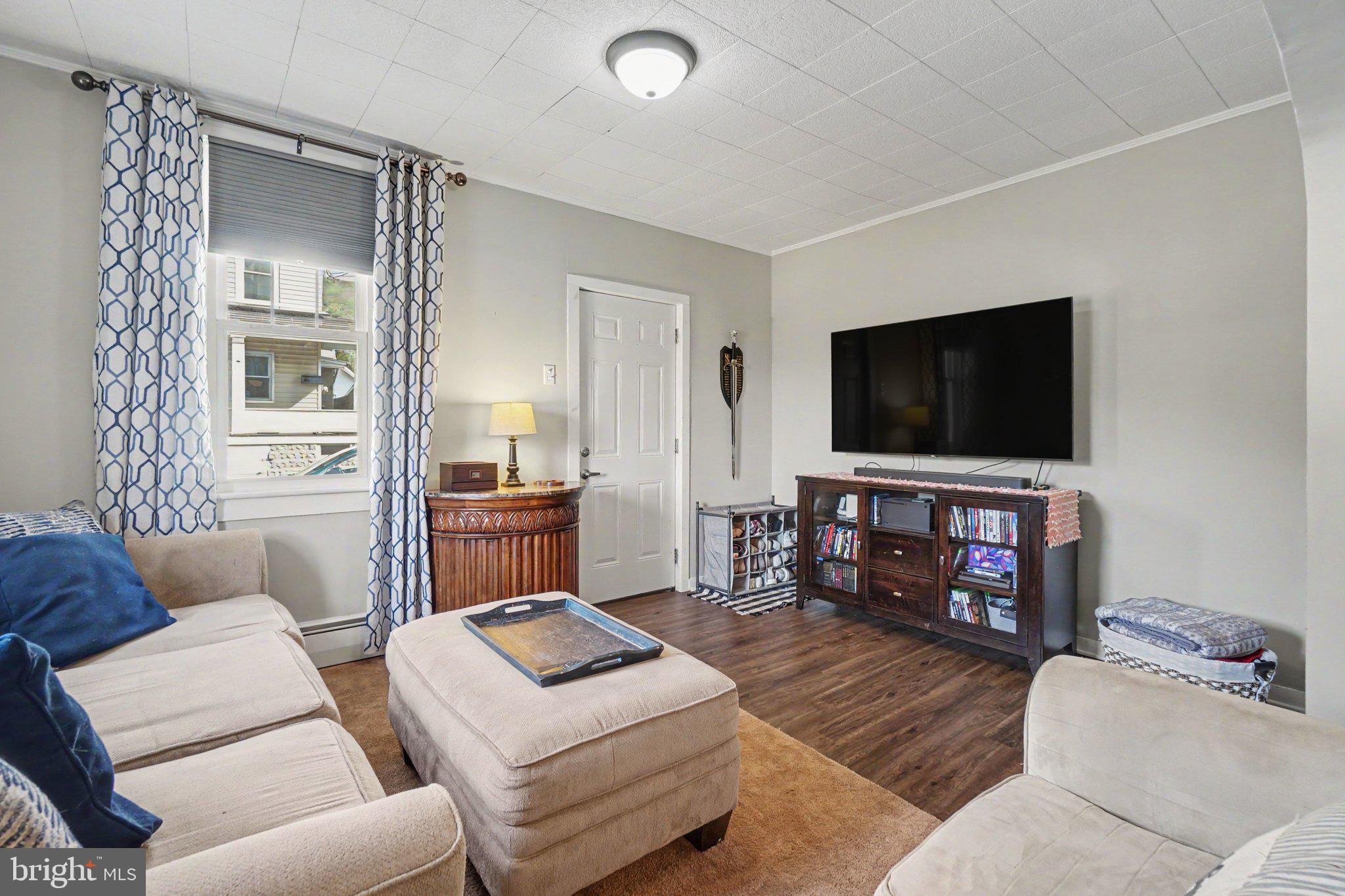 418 Elizabeth Street Williamstown, PA 17098 - Photo 7 of 34 a living room with furniture and a flat screen tv