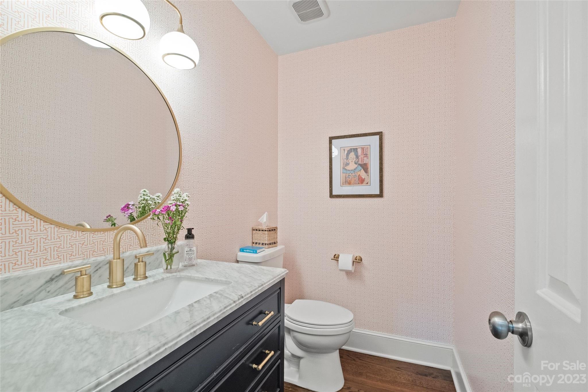 5013 Morrowick Road Charlotte, NC 28226 - Photo 11 of 48 a bathroom with a granite countertop sink a toilet and a mirror