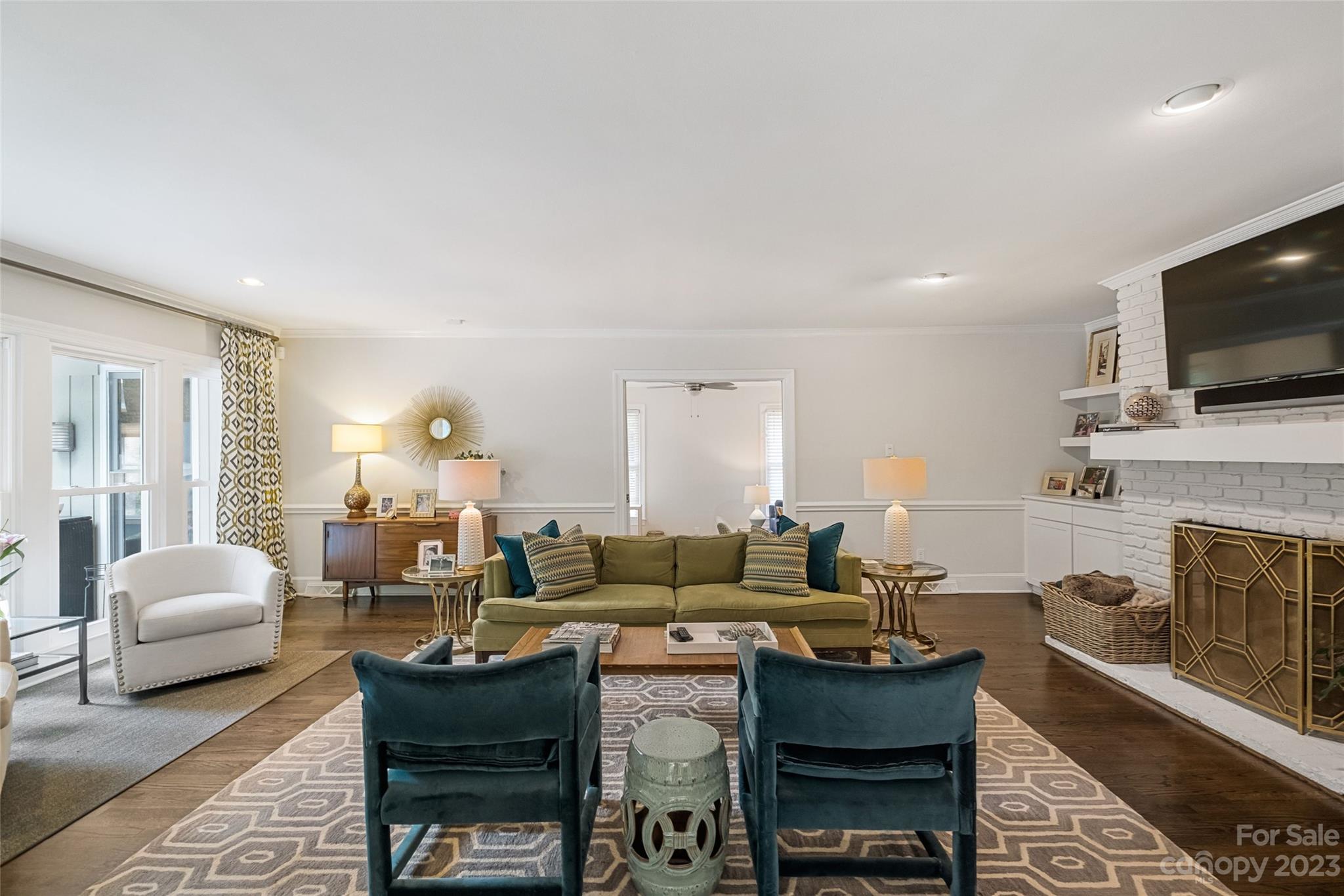 5013 Morrowick Road Charlotte, NC 28226 - Photo 12 of 48 a living room with fireplace furniture and a flat screen tv