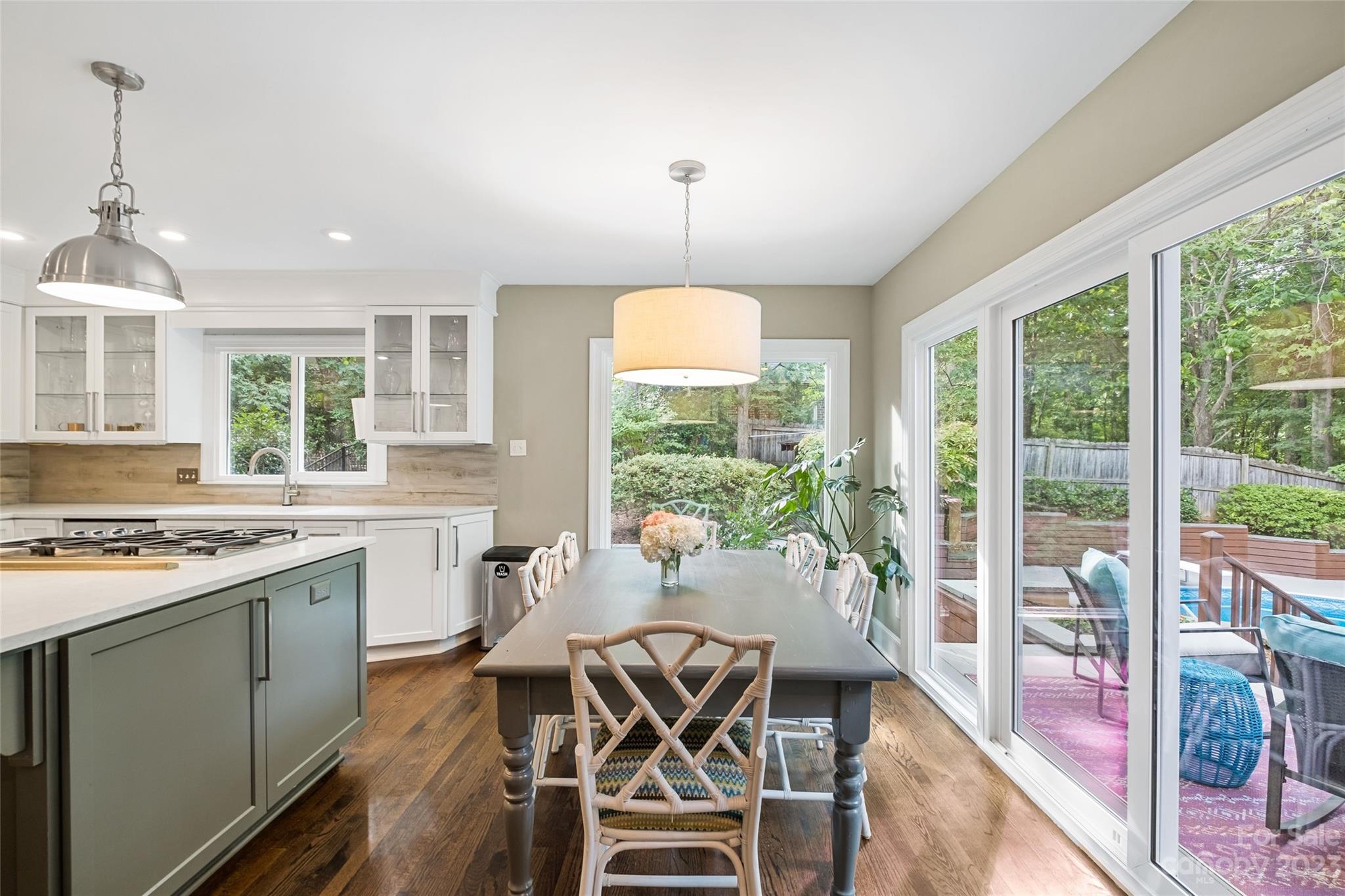 5013 Morrowick Road Charlotte, NC 28226 - Photo 23 of 48 a kitchen with a table chairs stove and cabinets