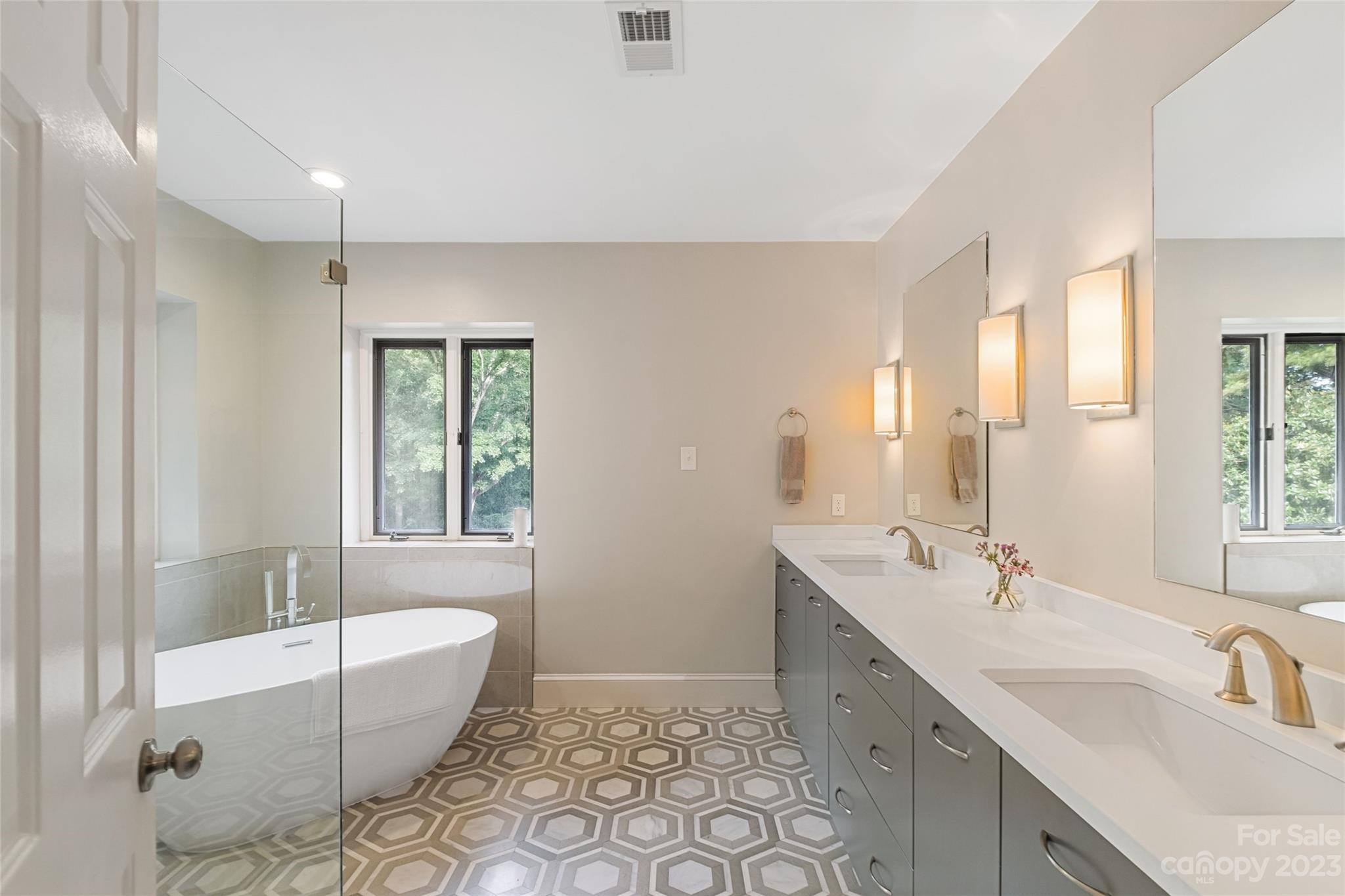 5013 Morrowick Road Charlotte, NC 28226 - Photo 26 of 48 a spacious bathroom with a tub sink and mirror