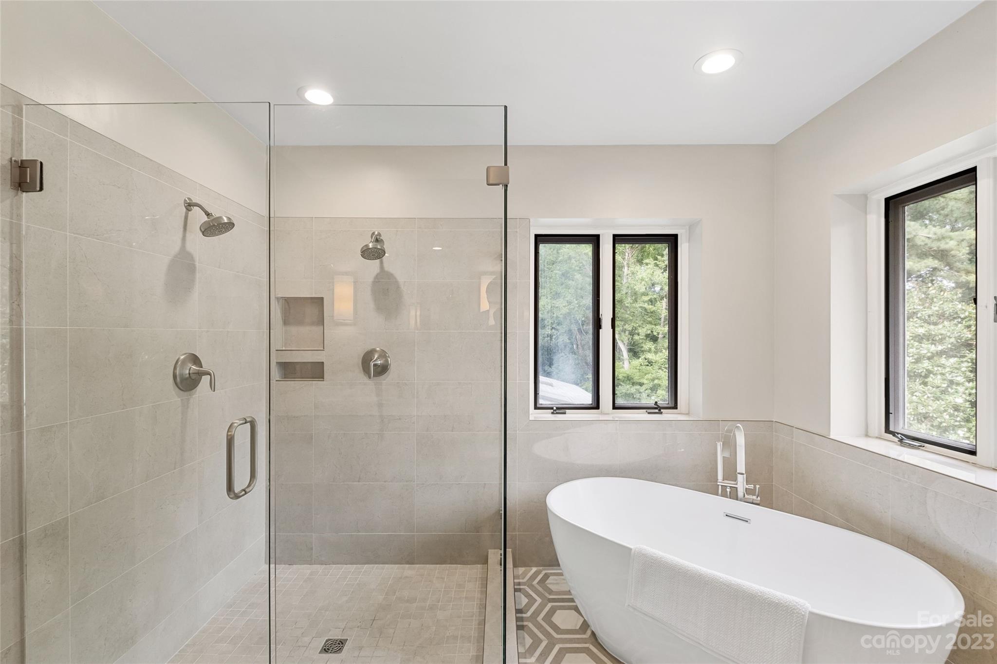 5013 Morrowick Road Charlotte, NC 28226 - Photo 27 of 48 a bathroom with a bathtub and shower