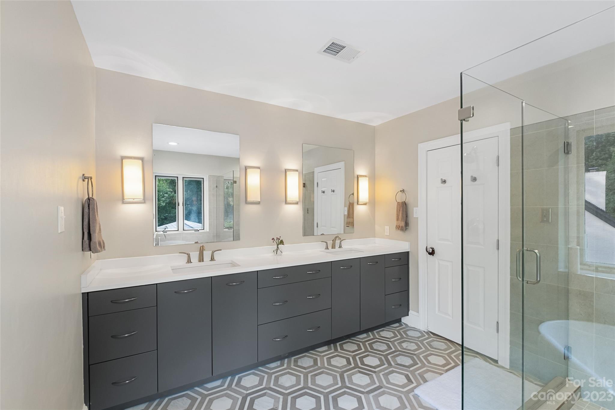 5013 Morrowick Road Charlotte, NC 28226 - Photo 28 of 48 a bathroom with a double vanity sink mirror and toilet