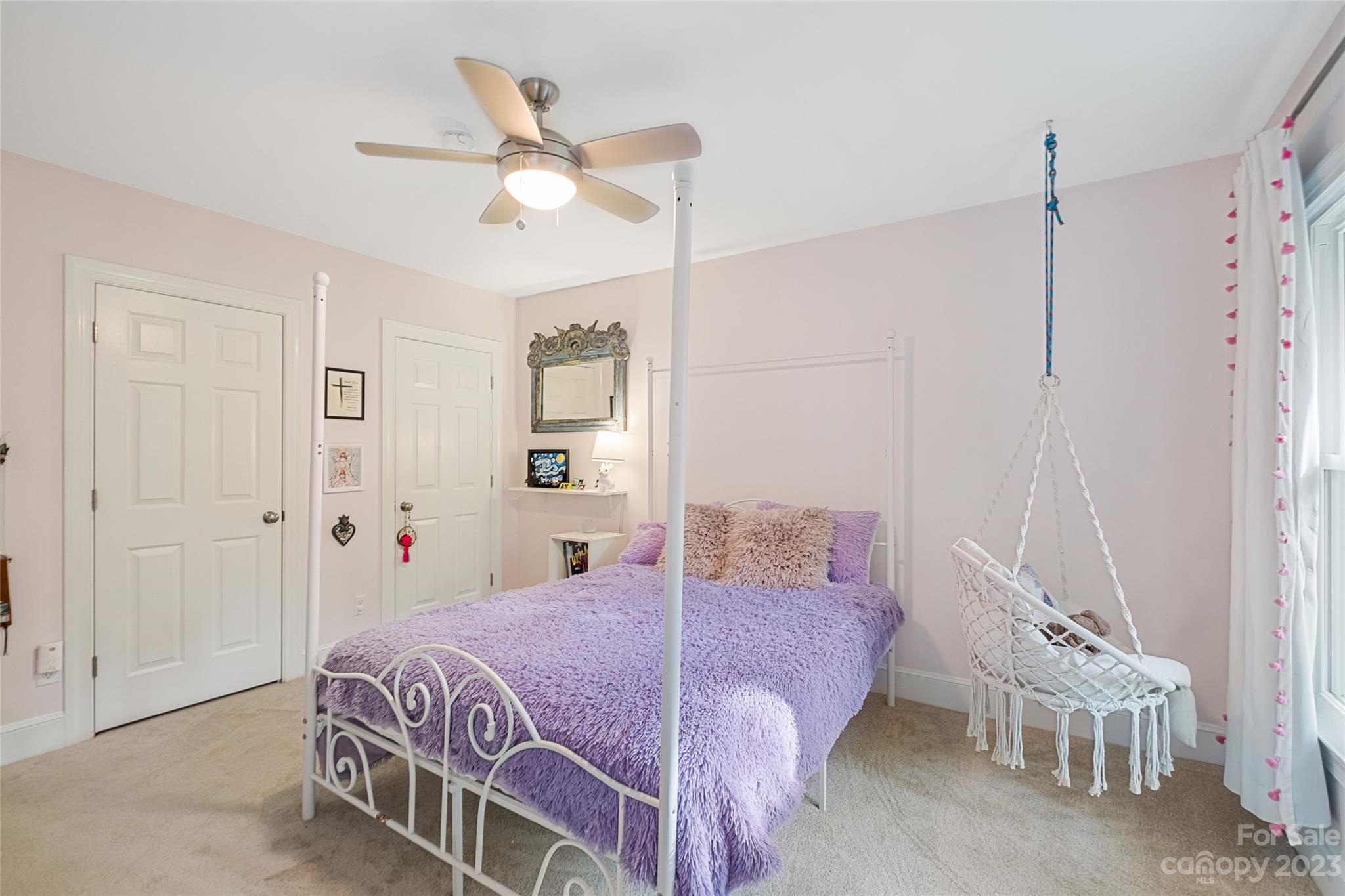 5013 Morrowick Road Charlotte, NC 28226 - Photo 32 of 48 a bed room with a bed and a chandelier