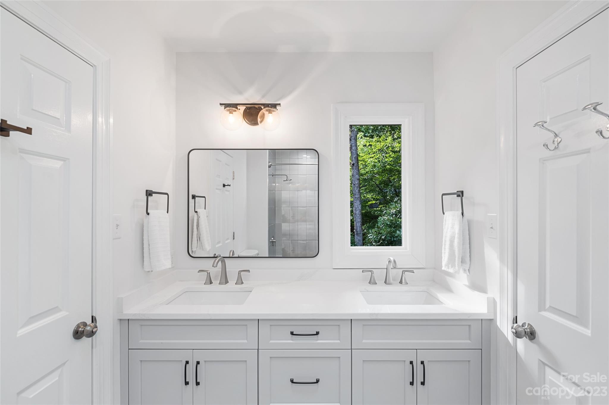 5013 Morrowick Road Charlotte, NC 28226 - Photo 33 of 48 a bathroom with a double vanity sink mirror and next to a window