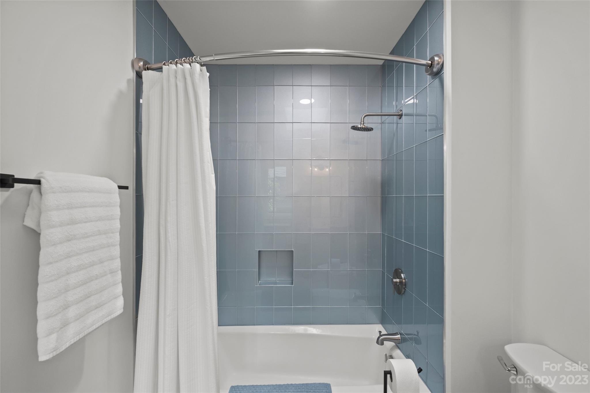 5013 Morrowick Road Charlotte, NC 28226 - Photo 34 of 48 a bathroom with a shower and a toilet