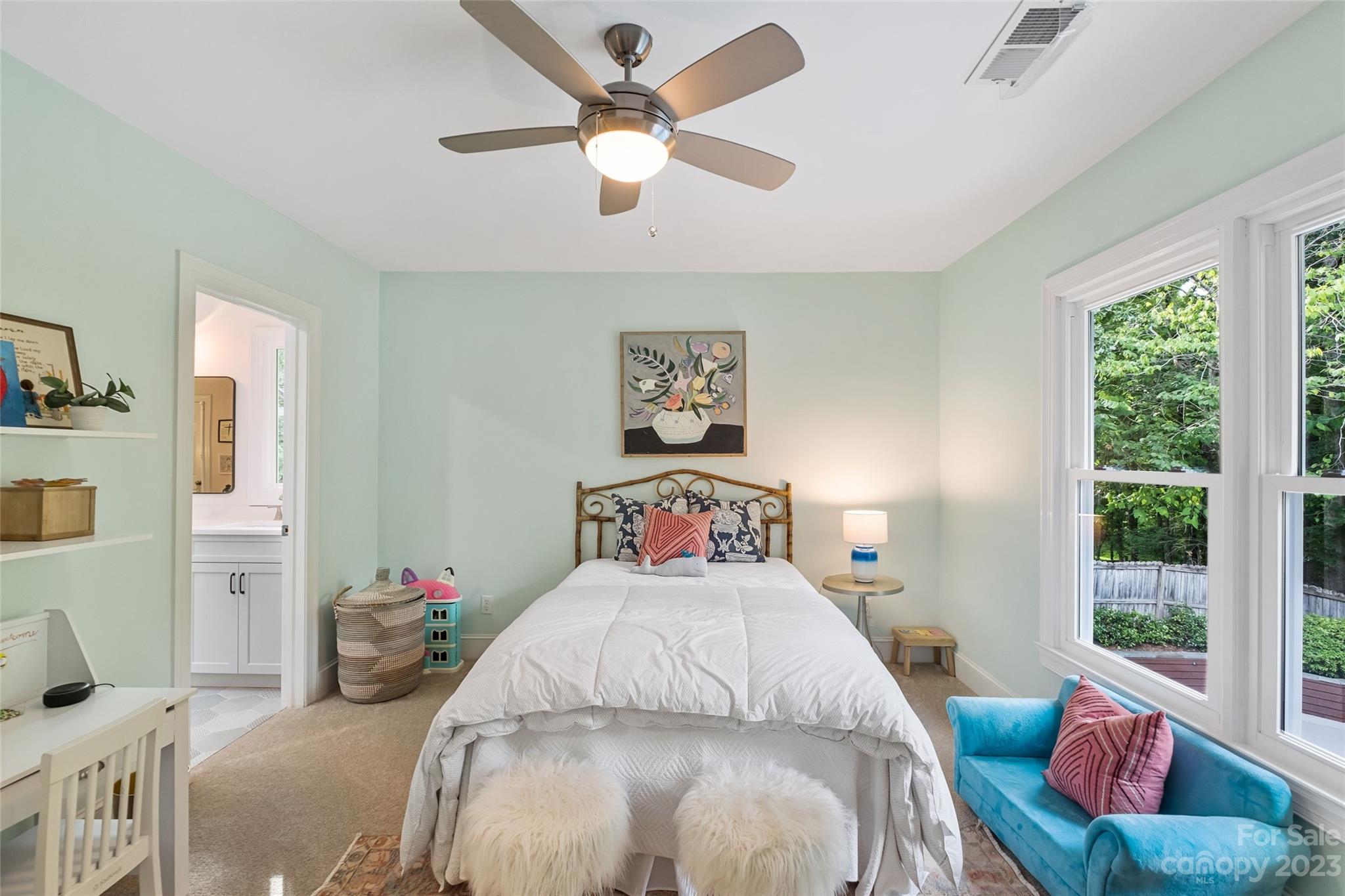 5013 Morrowick Road Charlotte, NC 28226 - Photo 35 of 48 a bedroom with a bed a couch and a window