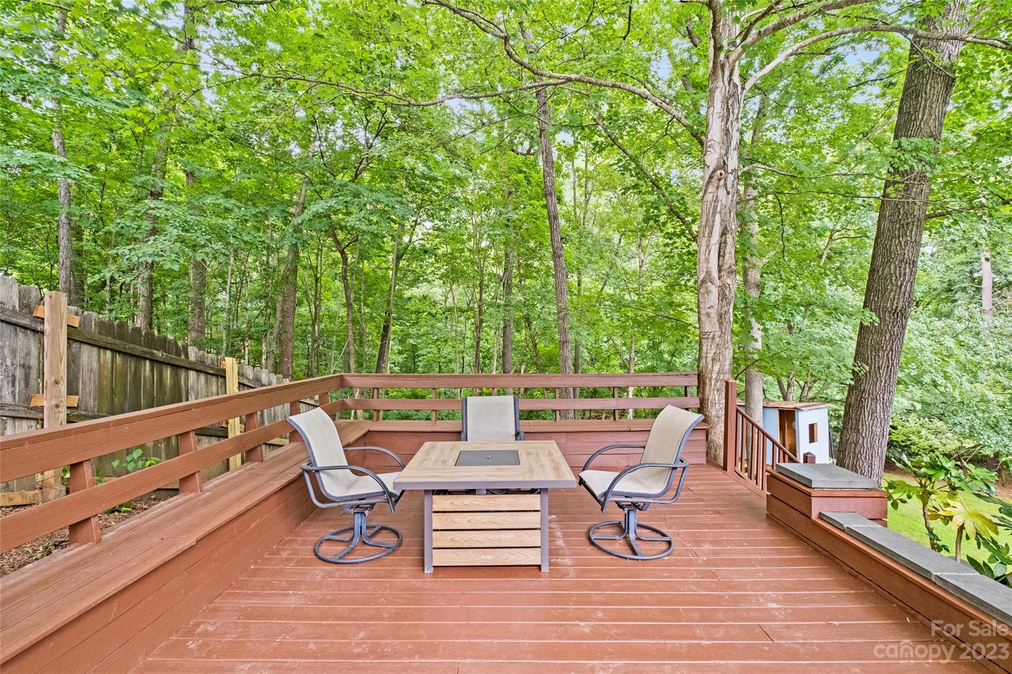 5013 Morrowick Road Charlotte, NC 28226 - Photo 41 of 48 a roof deck with table and chairs and wooden floor