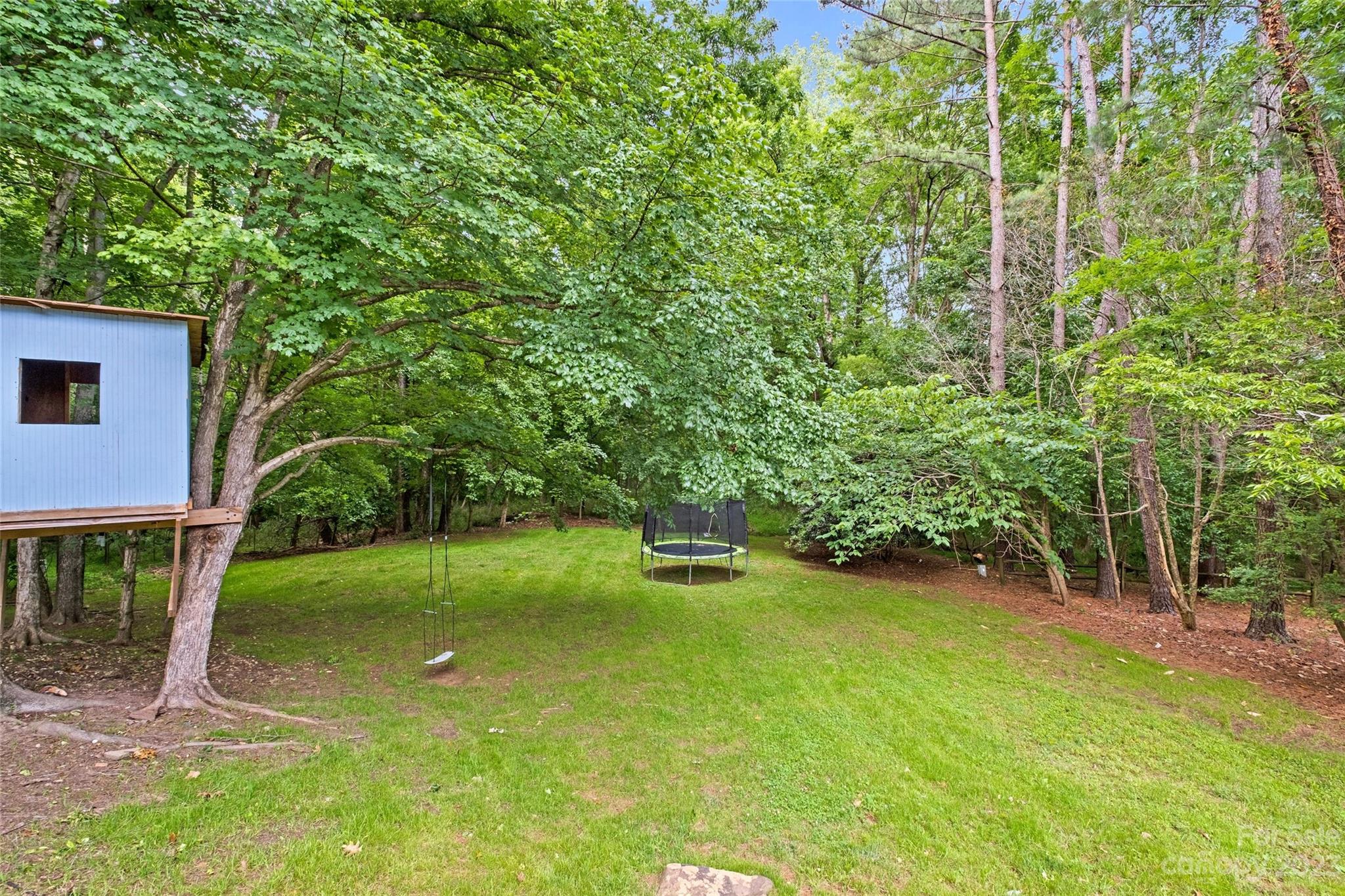 5013 Morrowick Road Charlotte, NC 28226 - Photo 44 of 48 a view of a backyard with a garden