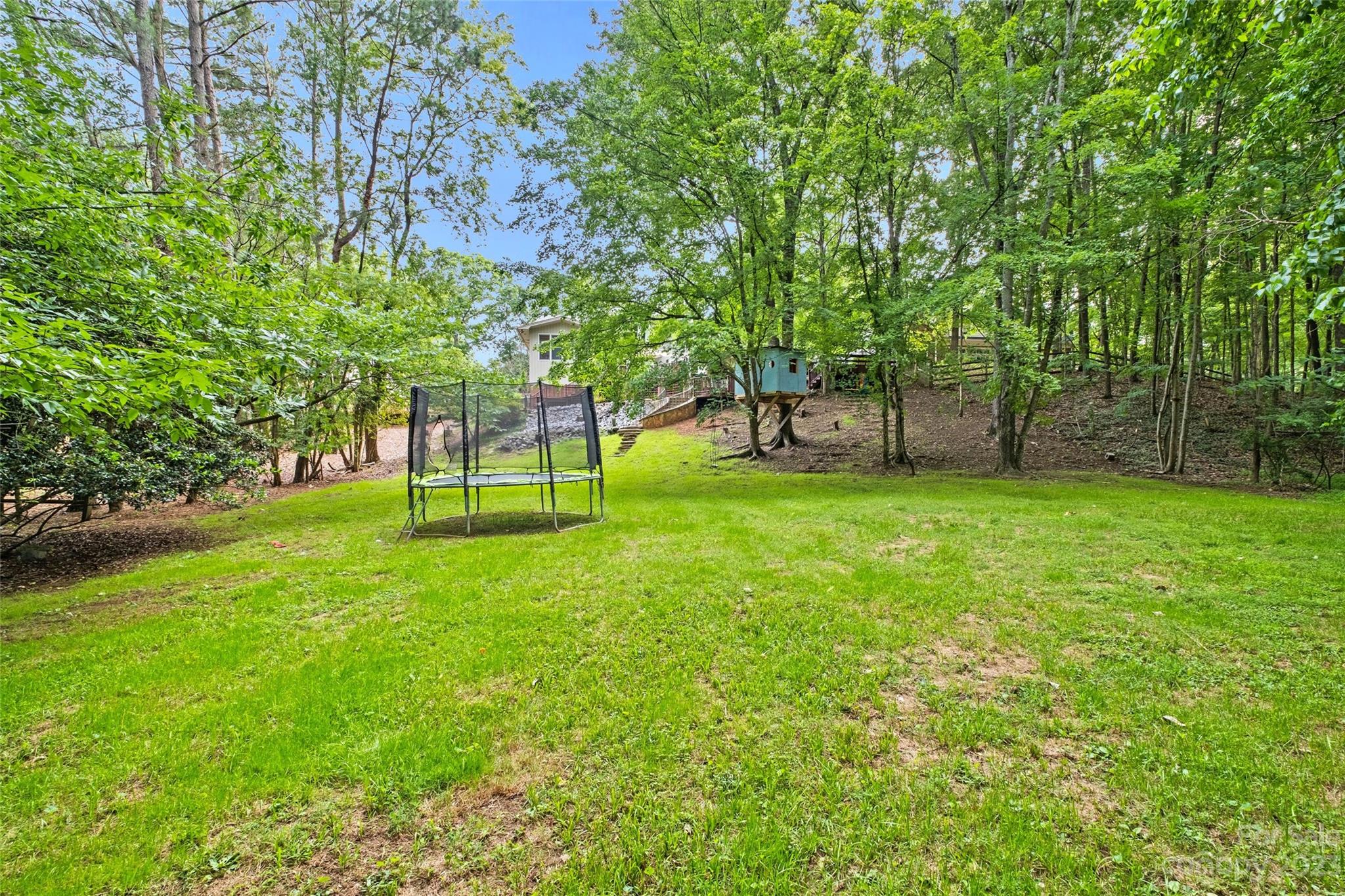 5013 Morrowick Road Charlotte, NC 28226 - Photo 45 of 48 a backyard of a house with lots of green space