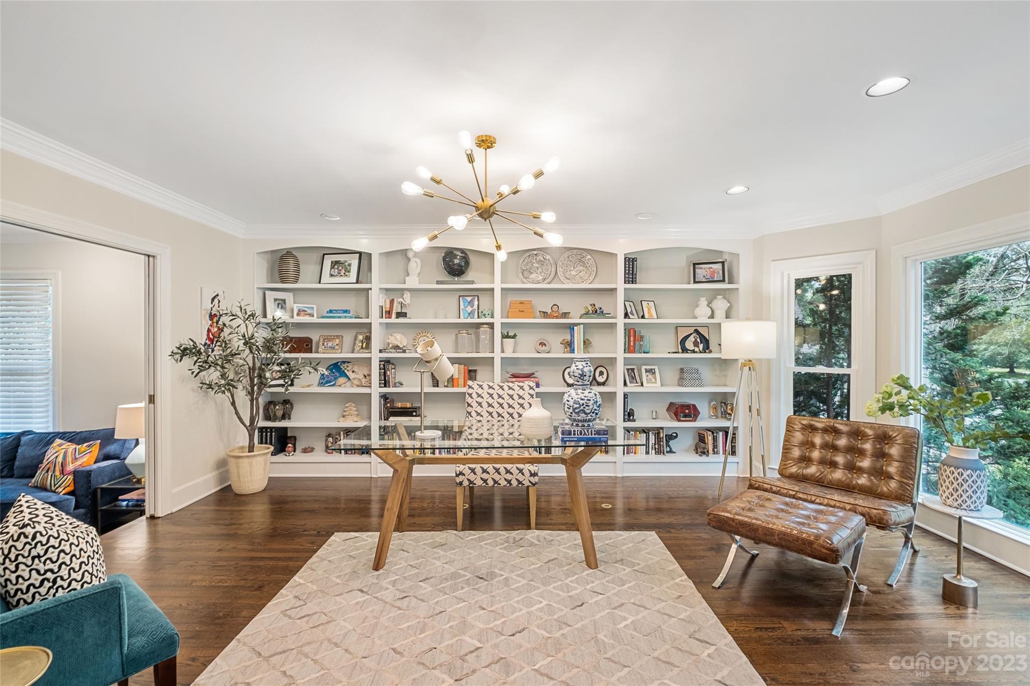 5013 Morrowick Road Charlotte, NC 28226 - Photo 9 of 48 a living room with furniture and a book shelf