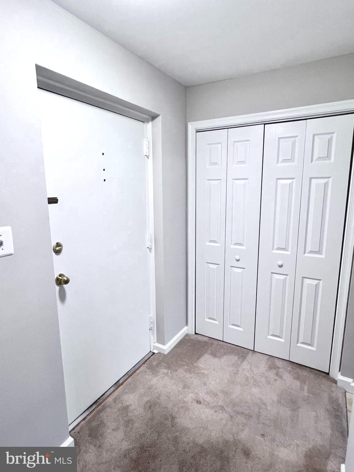 5111 8th Road South, Unit 202 Arlington, VA 22204 - Photo 3 of 41 Entry foyer with coat closet