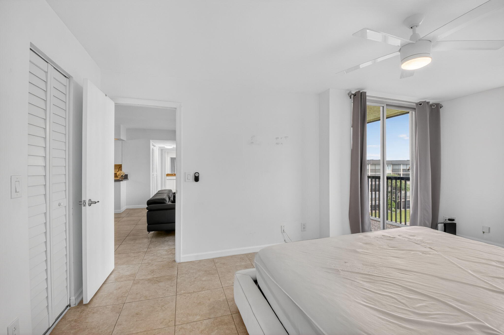 5280 Northwest 2nd Avenue, Unit PH17 Boca Raton, FL 33487 - Photo 15 of 35 15 Primary Bedroom Entry & Balcony View