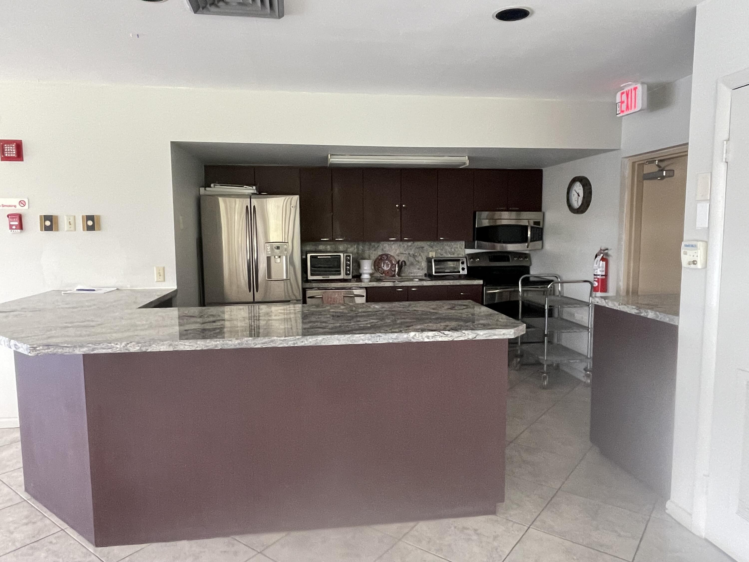 5280 Northwest 2nd Avenue, Unit PH17 Boca Raton, FL 33487 - Photo 32 of 35 32 Clubhouse Kitchen