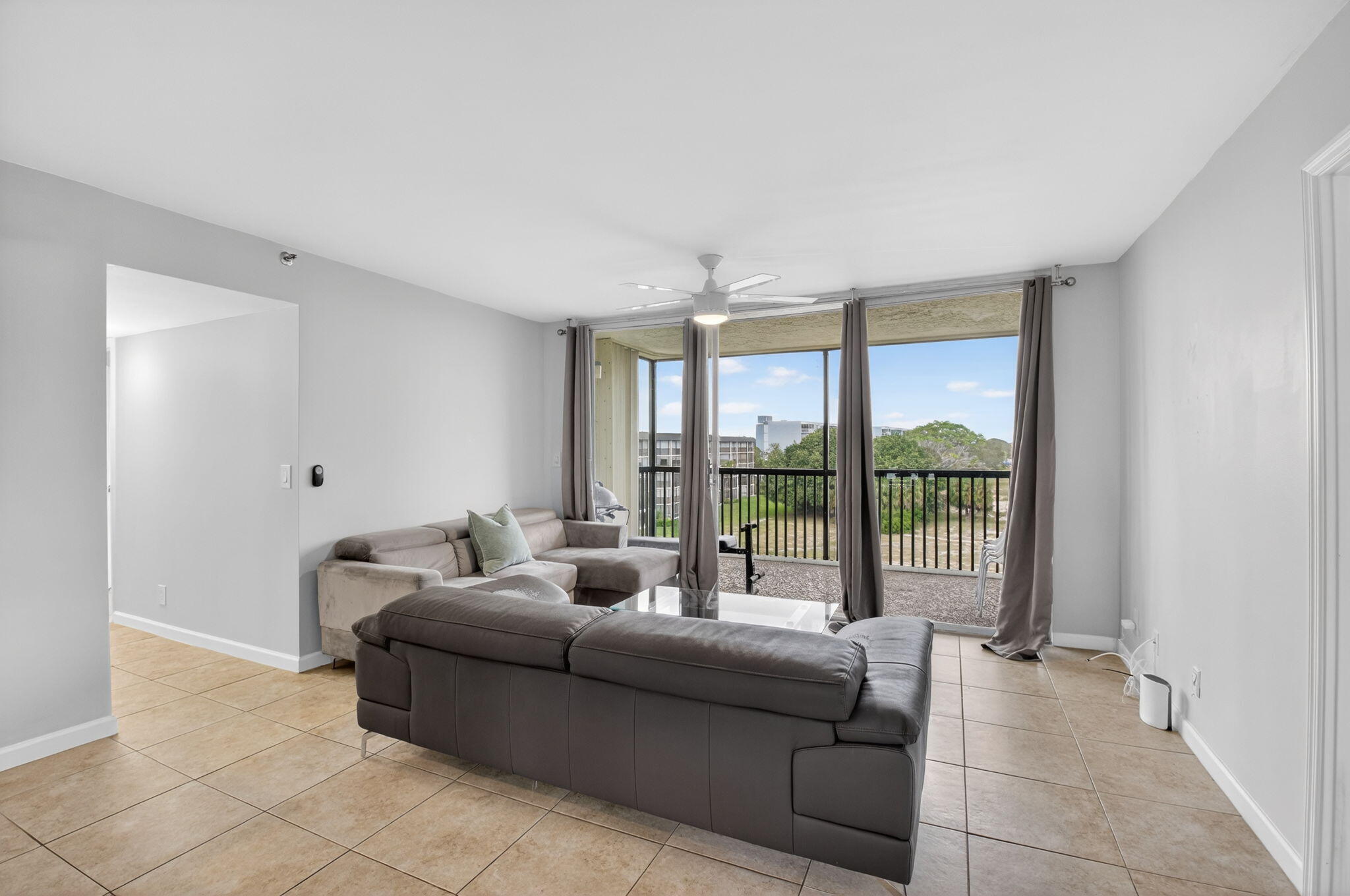 5280 Northwest 2nd Avenue, Unit PH17 Boca Raton, FL 33487 - Photo 6 of 35 6-Living Room 2