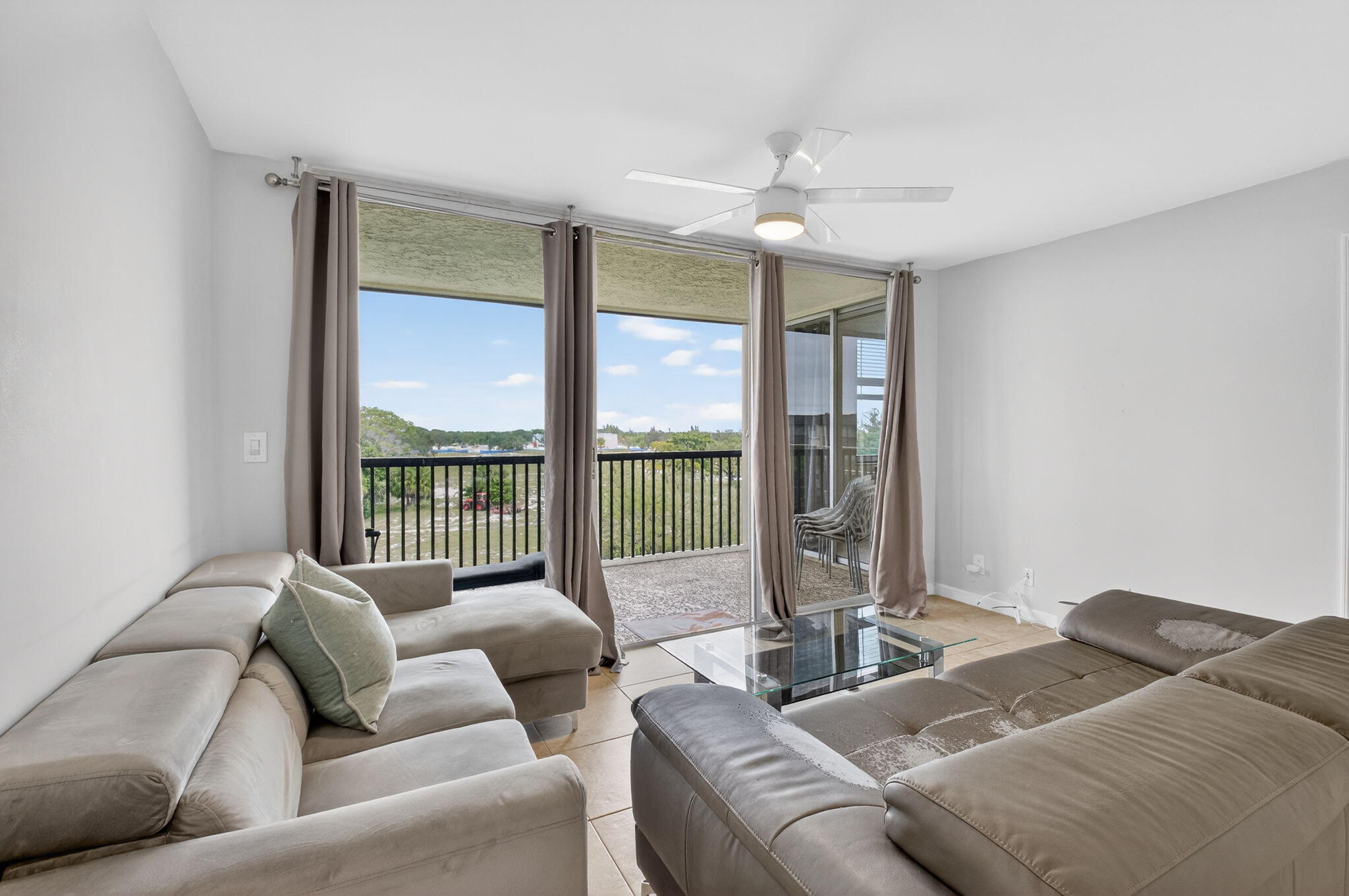 5280 Northwest 2nd Avenue, Unit PH17 Boca Raton, FL 33487 - Photo 7 of 35 7-Living Room and Balcony