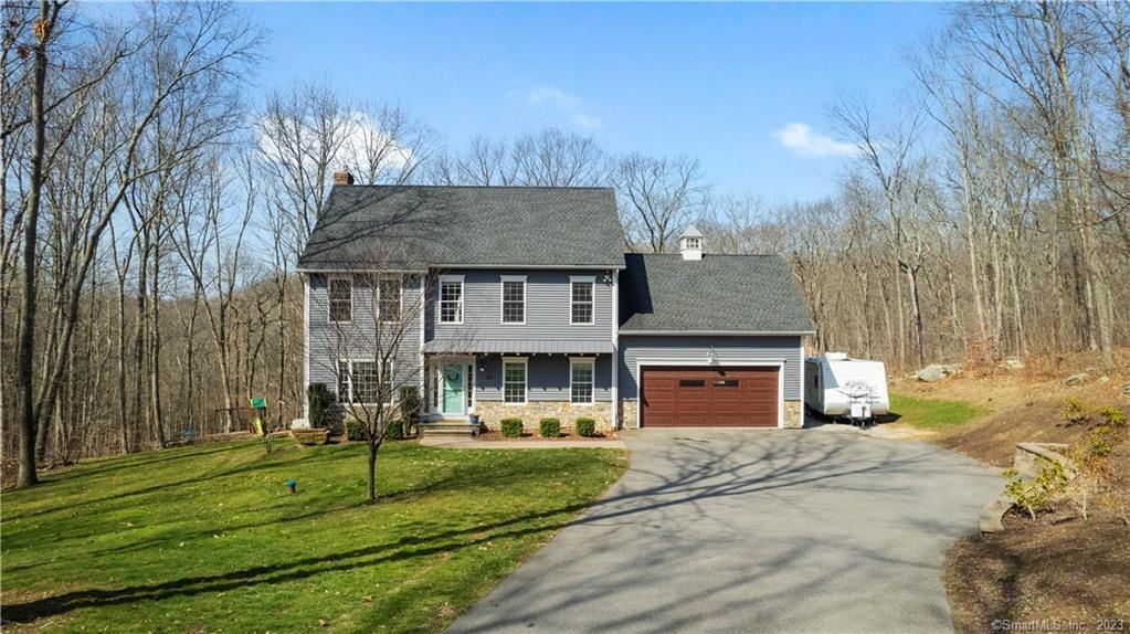 301 Warpas Road Madison, CT 06443 - Photo 1 of 1 a front view of a house with a yard