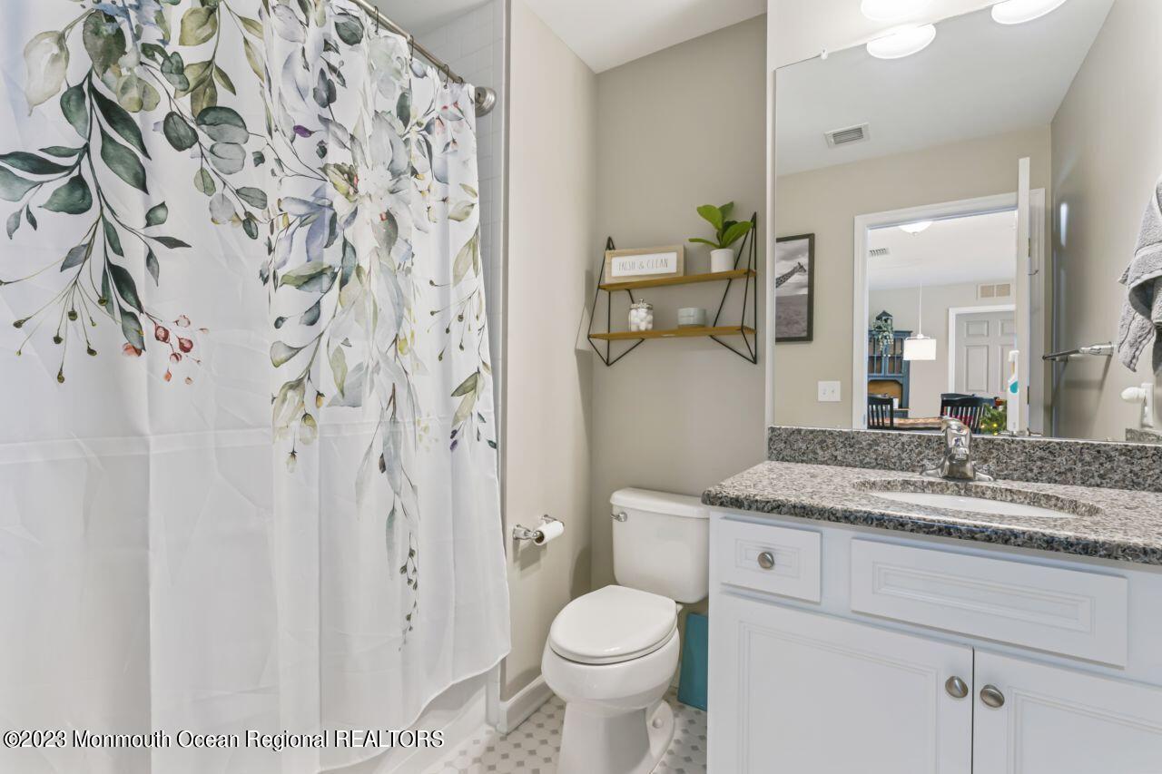 68 Harvest Ridge Road Howell, NJ 07731 - Photo 25 of 45 a bathroom with a granite countertop sink toilet and shower