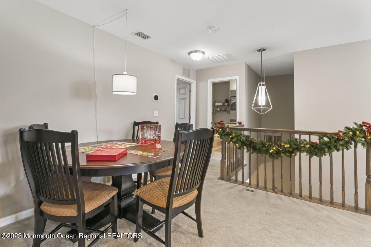 68 Harvest Ridge Road Howell, NJ 07731 - Photo 36 of 45 a dining room with furniture and wooden floor