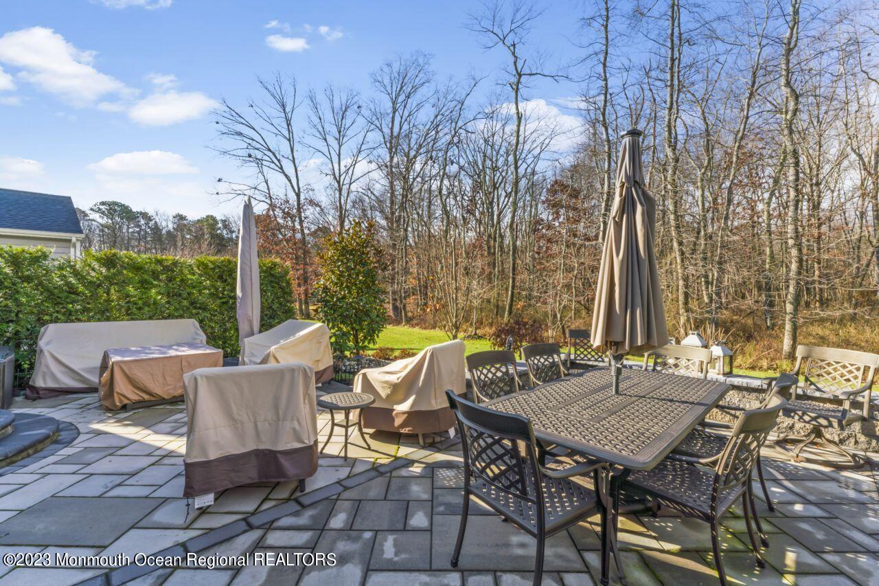 68 Harvest Ridge Road Howell, NJ 07731 - Photo 44 of 45 a view of a patio with a table and chairs