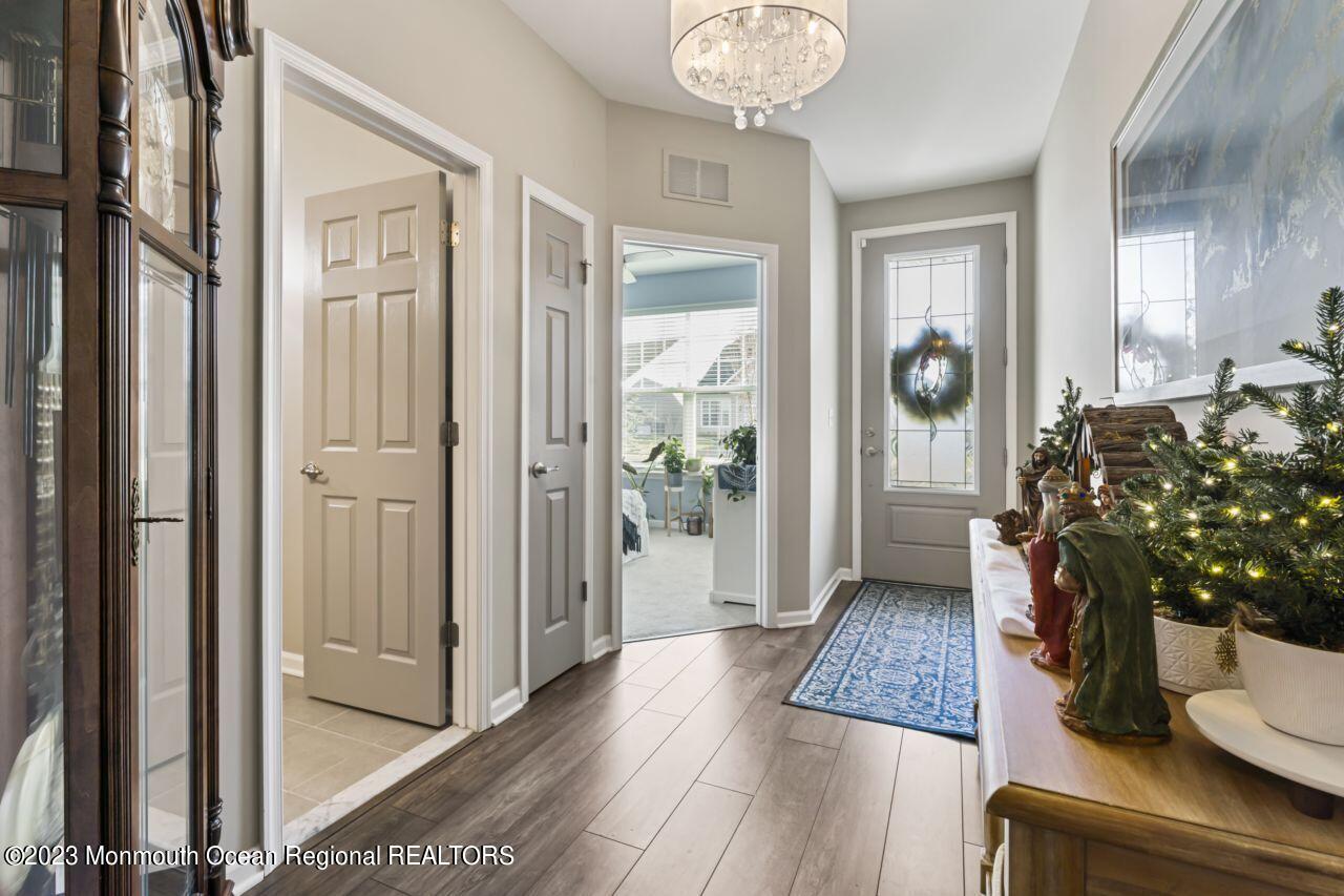 68 Harvest Ridge Road Howell, NJ 07731 - Photo 7 of 45 a living room with furniture and a potted plant