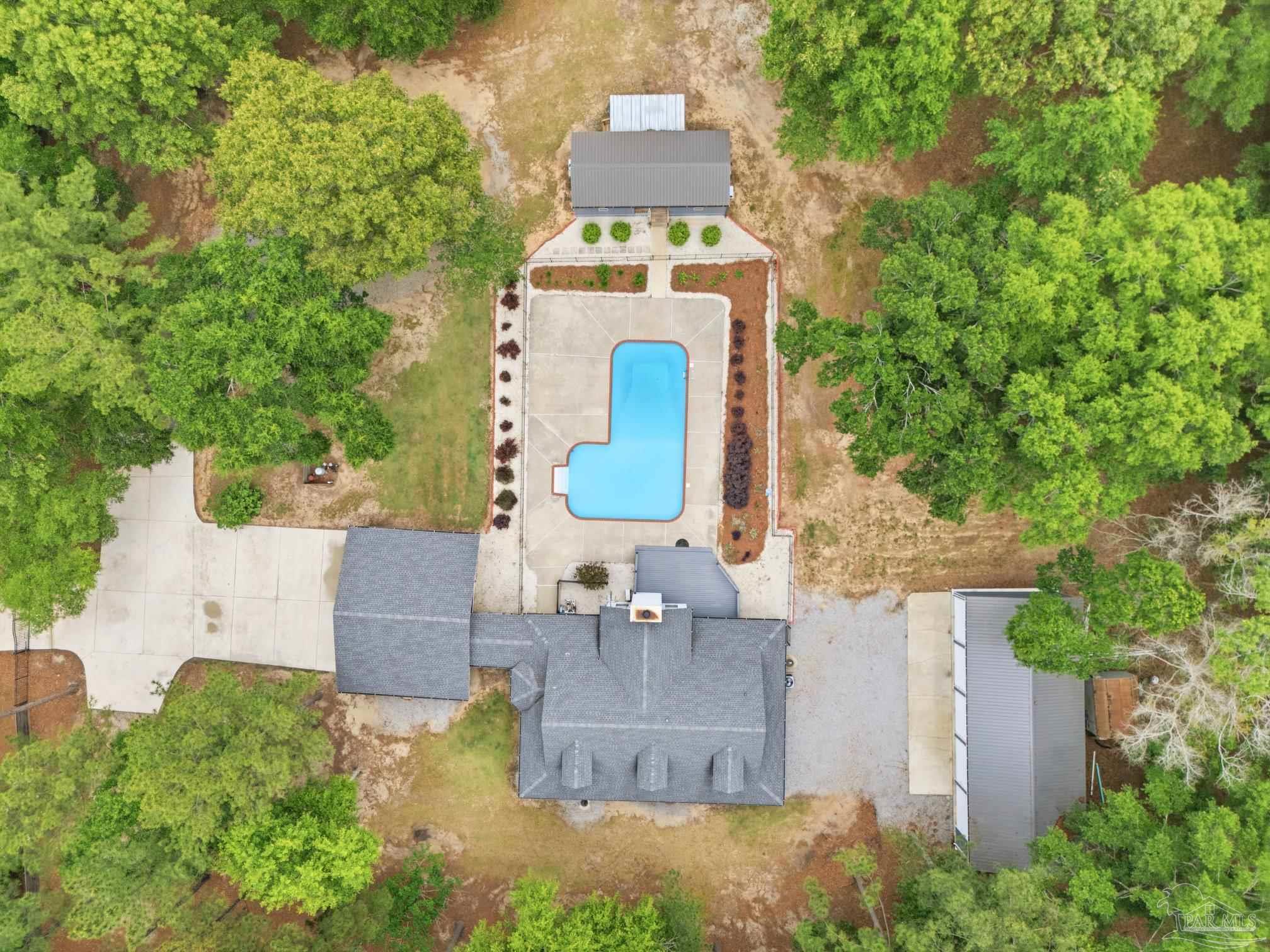an aerial view of a house with outdoor space and street view