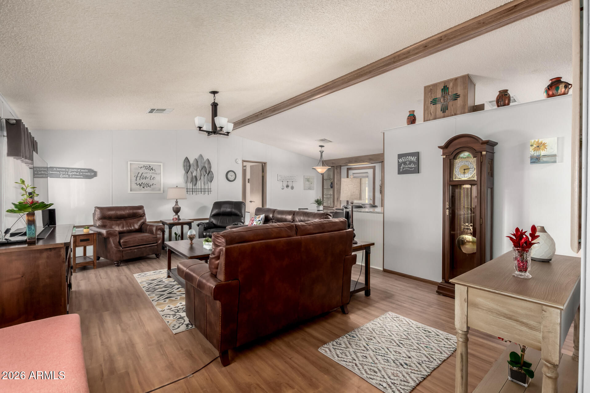 652 South Ellsworth Road, Unit 152 Mesa, AZ 85208 - Photo 11 of 30 a living room with furniture and wooden floor