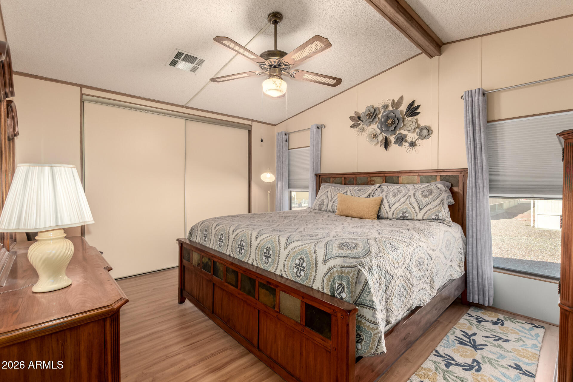 652 South Ellsworth Road, Unit 152 Mesa, AZ 85208 - Photo 19 of 30 a bedroom with a large bed and a window
