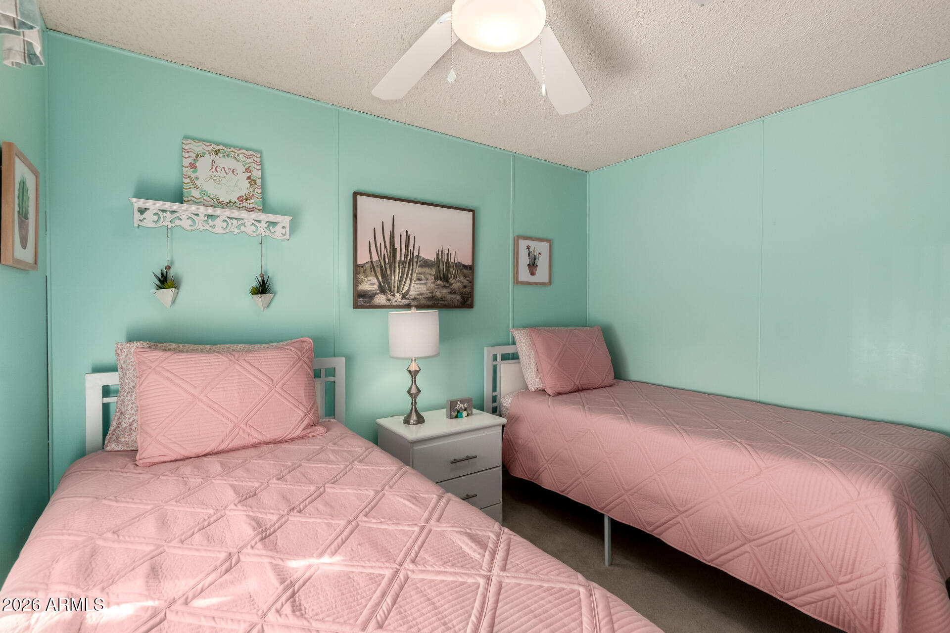 652 South Ellsworth Road, Unit 152 Mesa, AZ 85208 - Photo 23 of 30 a bedroom with a bed and a painting on the wall