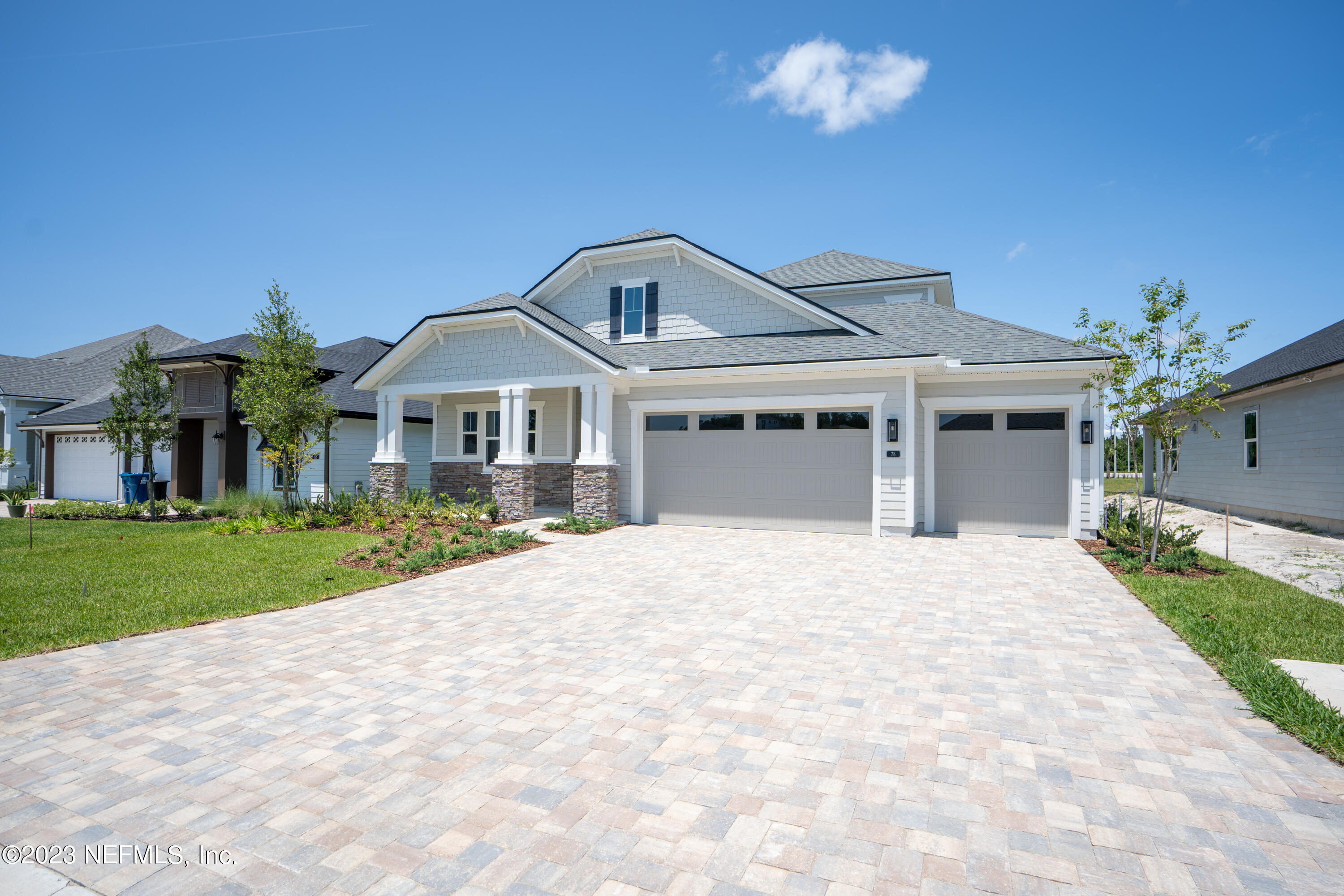 78 Clearview Drive St. Augustine, FL 32092 - Photo 1 of 61 a front view of a house with a yard and garage